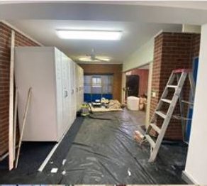 Classroom before cleaning — dusty floor and builders debris
