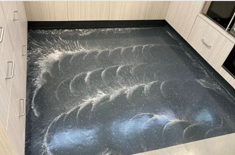 Freshly polished vinyl floor with visible machine pattern
